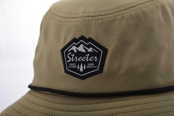 Streeter olive green bucket hat with a woven label at the front KN2102194