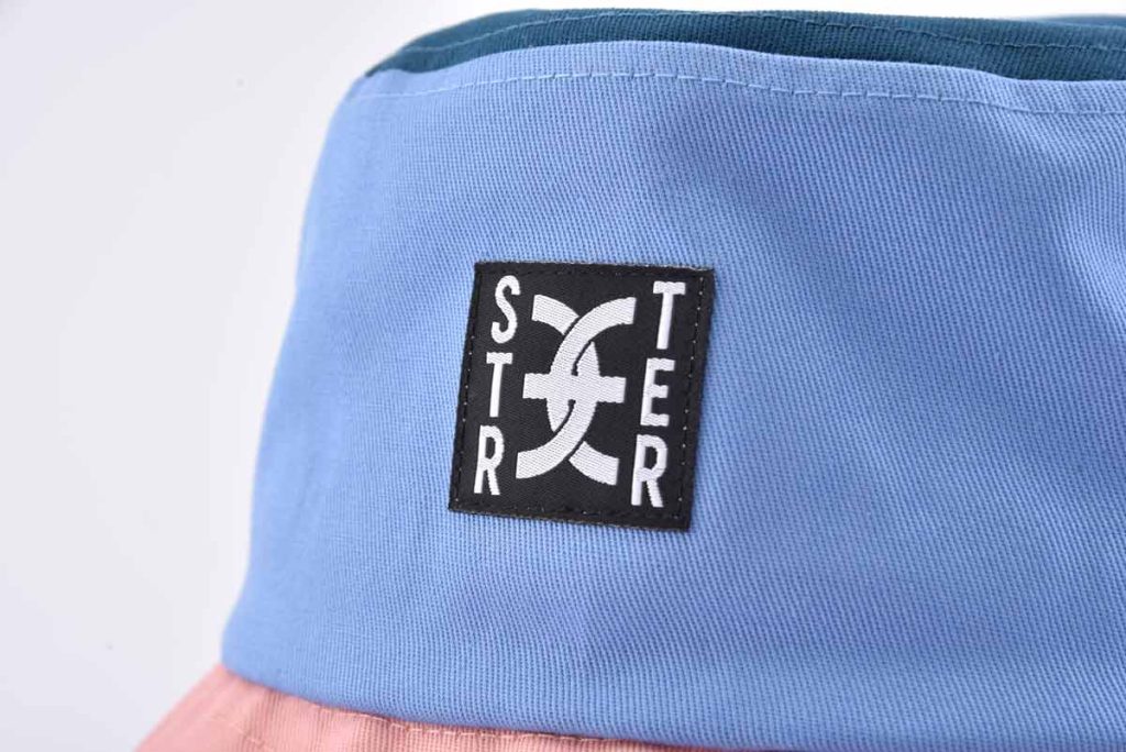 Streeter patchwork bucket hat with a woven label at the front SFG-210310-3