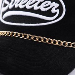 Streeter-unisex-mesh-trucker-hat-with-a-golden-decorative-chain-between-the-crown-and-the-brim-KN2102051