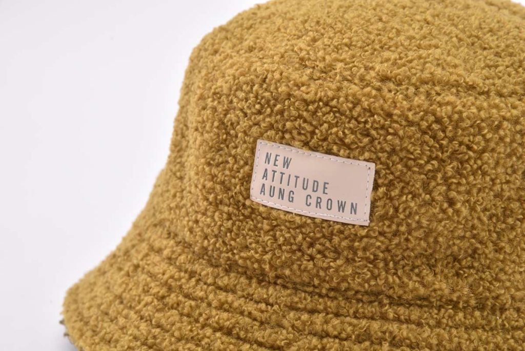 teddy bucket hat with a leather patch on the front KN2012074