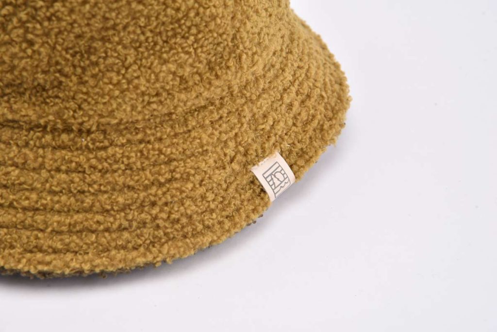 teddy bucket hat with a woven label on the brim KN2012074