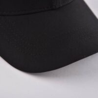 the-curved-brim-of-the-black-and-white-baseball-hat-at-right-side-KN2012232