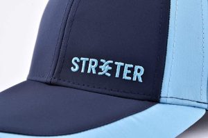 the flat embroidery letters on the dark blue baseball cap KN2103126